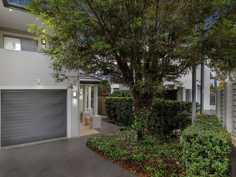 Sun washed modern home in prized riverside pocket