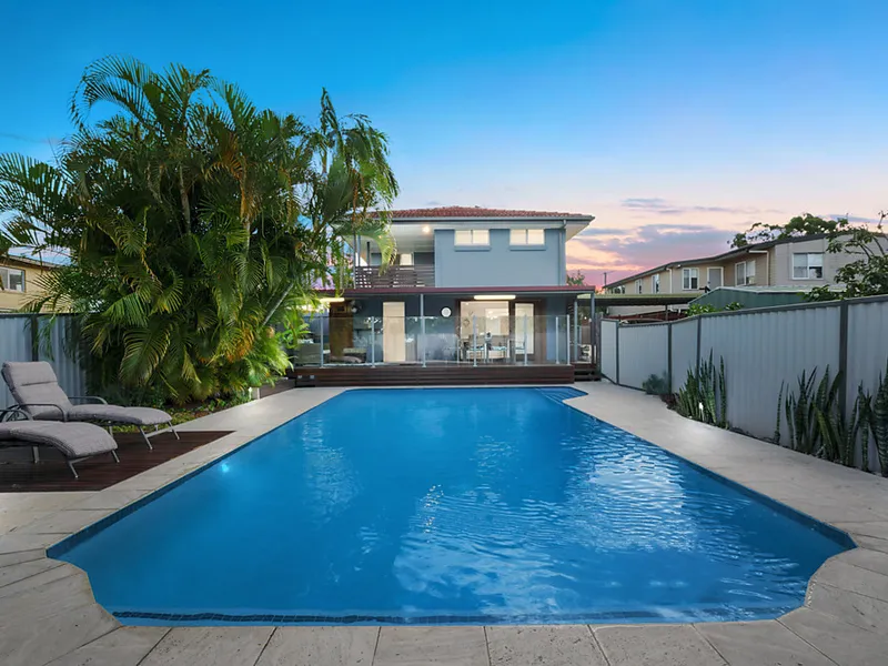 Family home with multiple living areas plus a swimming pool.