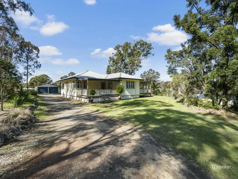 Spacious Timber Home on 5 Acres with Pool and Town Water