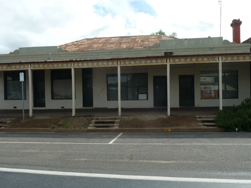 THREE SHOP FRONTS WITH RESIDENCE AT REAR