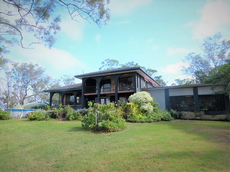 Esk 1ac $749000 split level Mediterranean style brick home set high on a hill looking towards the top end of Lake Wivenhoe.