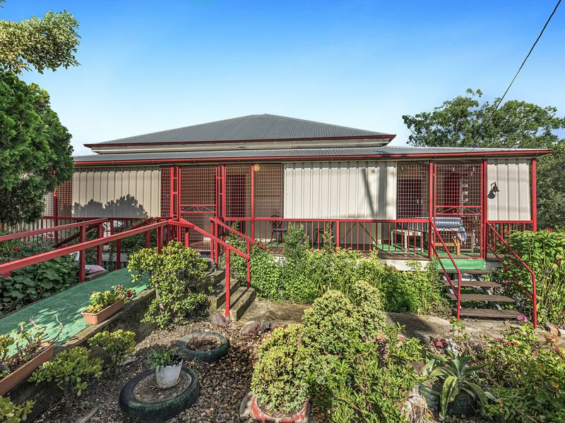 SPACIOUS FAMILY HOME ON OVER ½ ACRE WITH SHEDS!