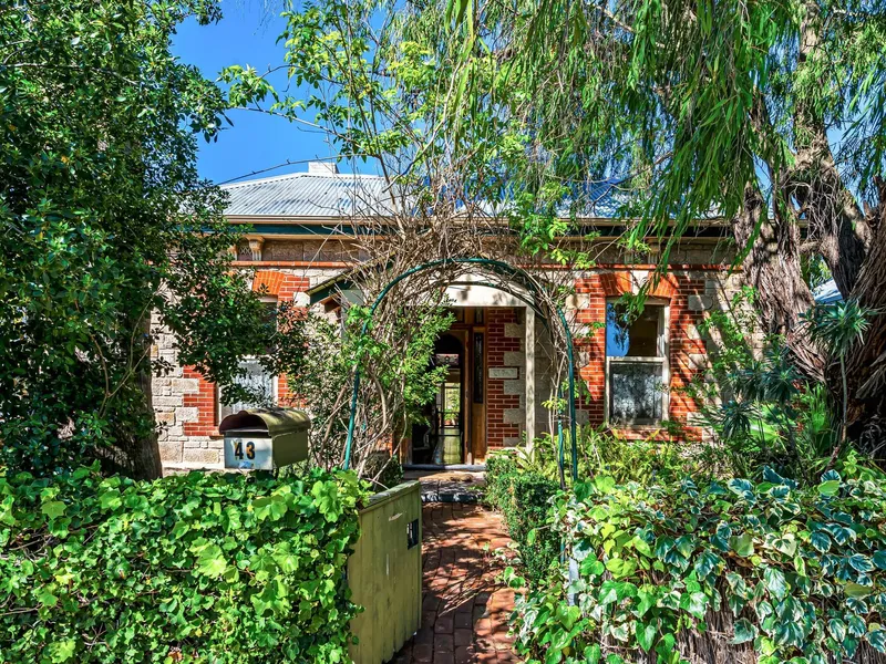 Charming stone fronted symmetrical cottage ( circa 1890 ) in leafy near-city Unley.