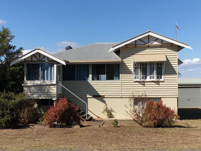 Immaculate 4 bedrooms & study  highset weatherboard on 57+acres with water