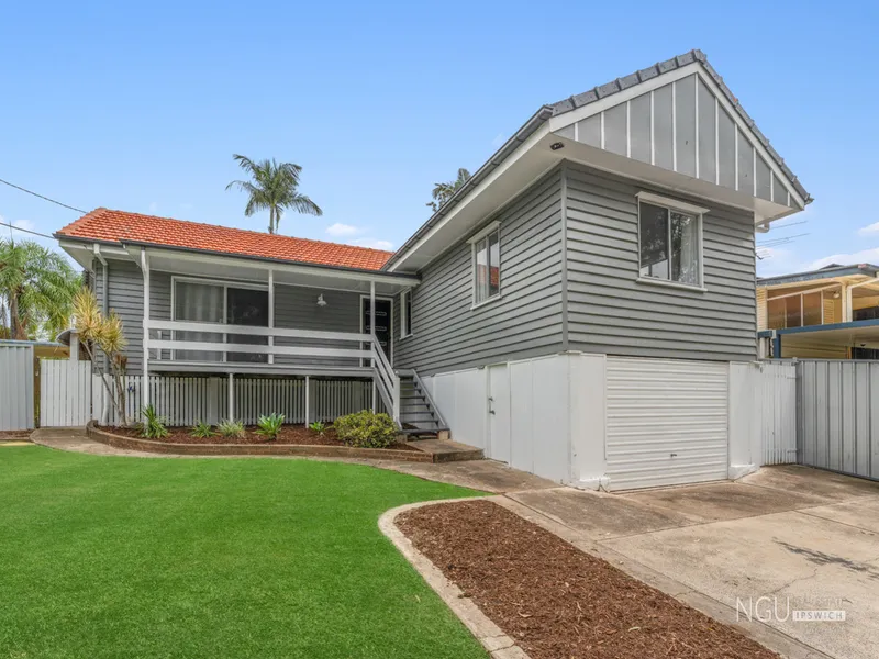 FRESHLY PAINTED, CORNER BLOCK RESIDENCE WITH REAR YARD ACCESS!