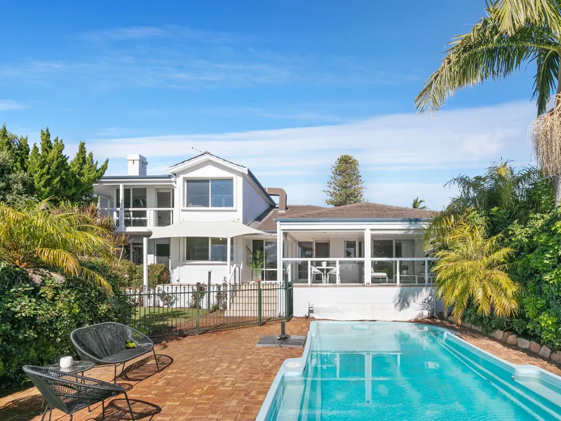 Elevated family sanctuary with river views.