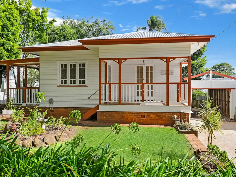 Cottage in Tree Lined Street