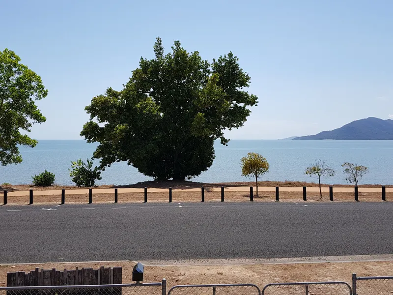 Beachfront home with panoramic sea views and large two bay shed