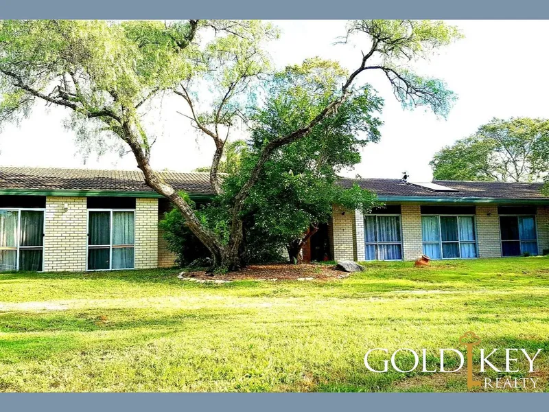 Quiet family home on Acreage within walking distance to everything.