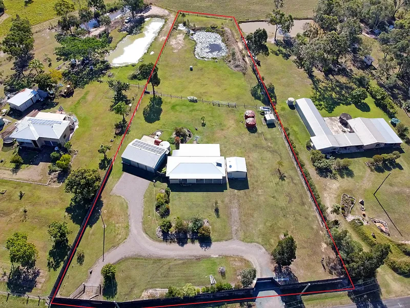 Home with sheds on 2 acres, top location!
