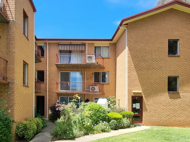 Ground floor with garage and balcony.