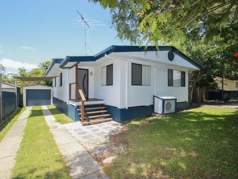 Fantastic 3 bedroom family home with large deck, separate garage, side access and great back yard in Eagleby