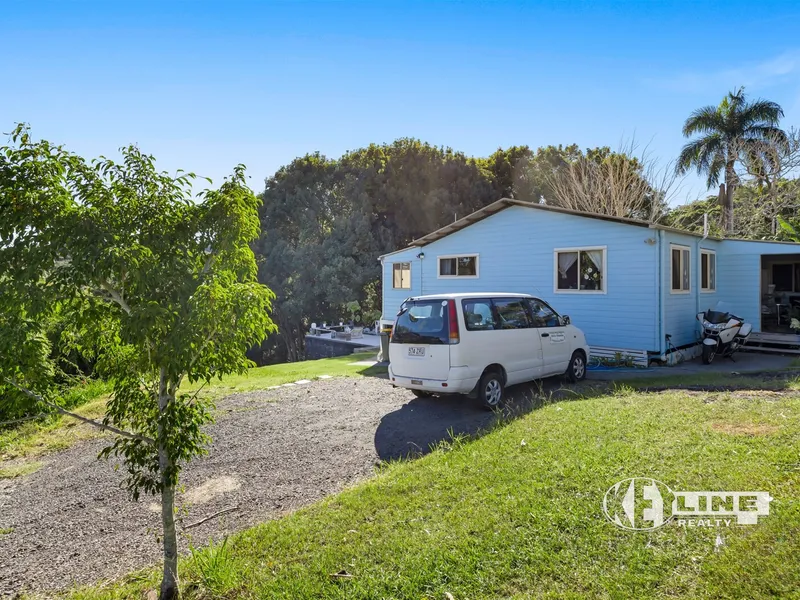 COUNTRY STYLE LIVING: HOME + STUDIO WITH VIEWS ON JUST UNDER AN ACRE