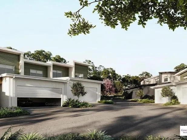 Modern townhouse with double garage and communal pool.