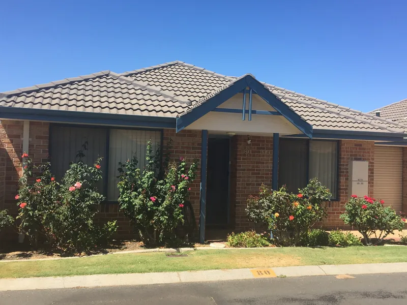 Lovely villa with a front garden full of beautiful roses