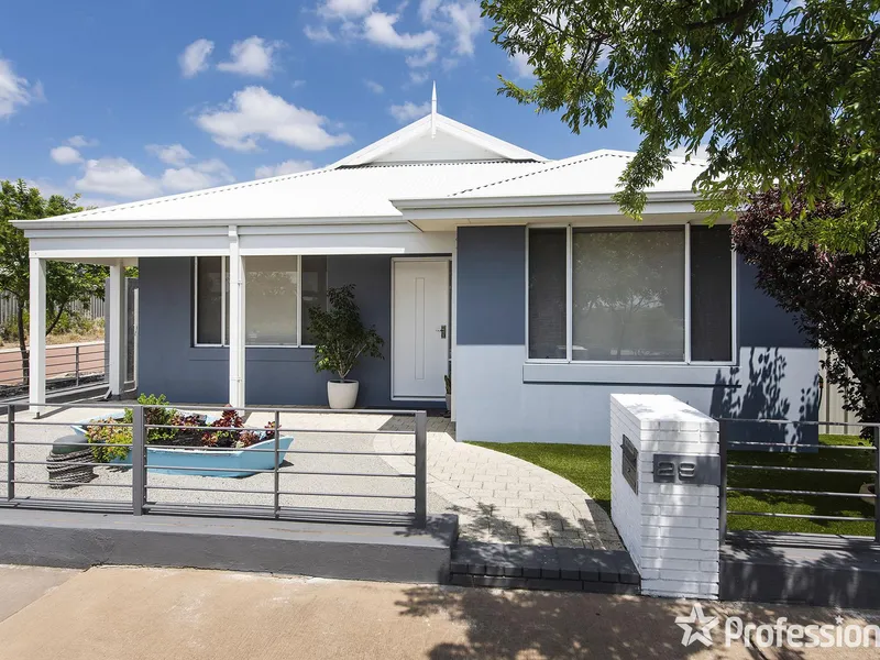 A charming home with a blue boat ready to set 