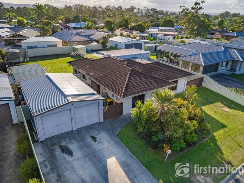 Contemporary home with massive shed & pool ready for new owners!