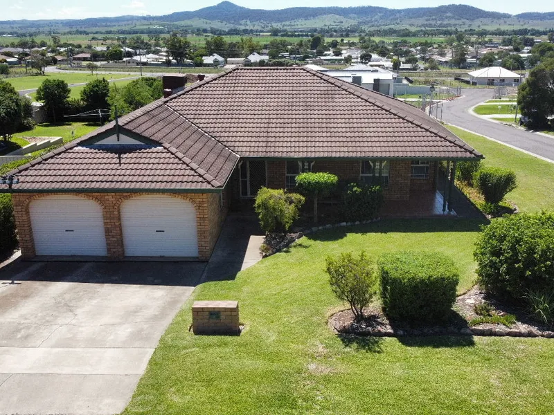 Well-presented and maintained four-bedroom brick veneer home set in west Denman with broad valley views Features Include: