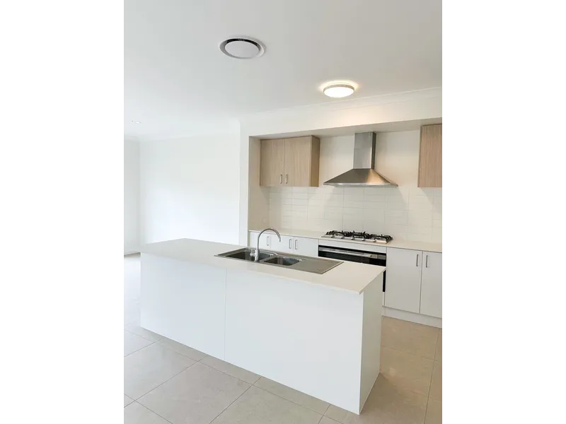 Brand New Luxury Home located along the Carrara border on the coastal side of the M1