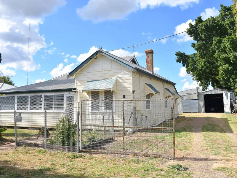 WEATHERBOARD HOME WITH A LARGE SHED