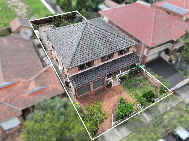 Quality double brick residence offers dual living potential with city views