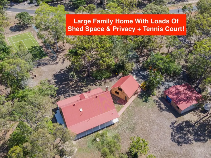LARGE FAMILY HOME ON 2.7 ACRES WITH 3 LIVING AREAS, TOWN WATER, TENNIS COURT & HUGE SHED SPACE!
