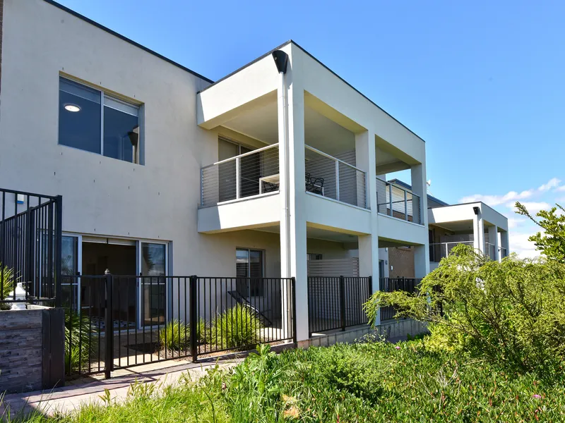 Modern two-storey townhouse with the peace and privacy of living within a prestigious community.