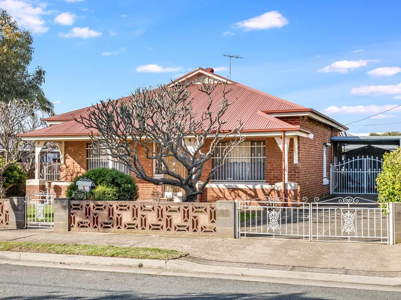 IMMACULATELY KEPT CHARACTER FAMILY HOME ON A HUGE CORNER ALLOTMENT