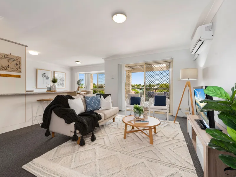 Stylish top floor living with sweeping suburban views