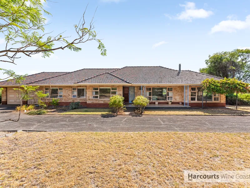 Spacious, Attractive Mid-Century Home offering The Perfect Lifestyle!