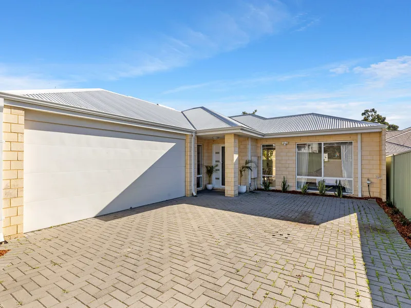 Rear survey-strata light filled home.