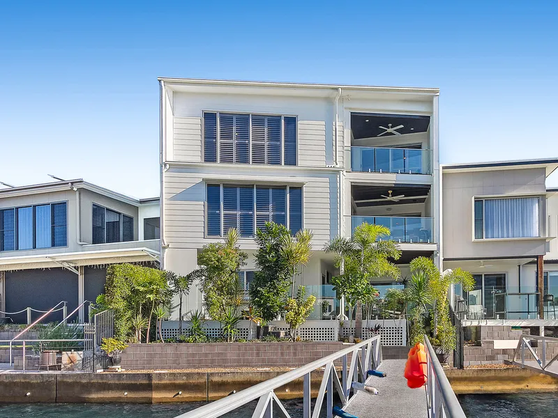 Executive tri-level waterfront residence with private pontoon, lift and deep-water access