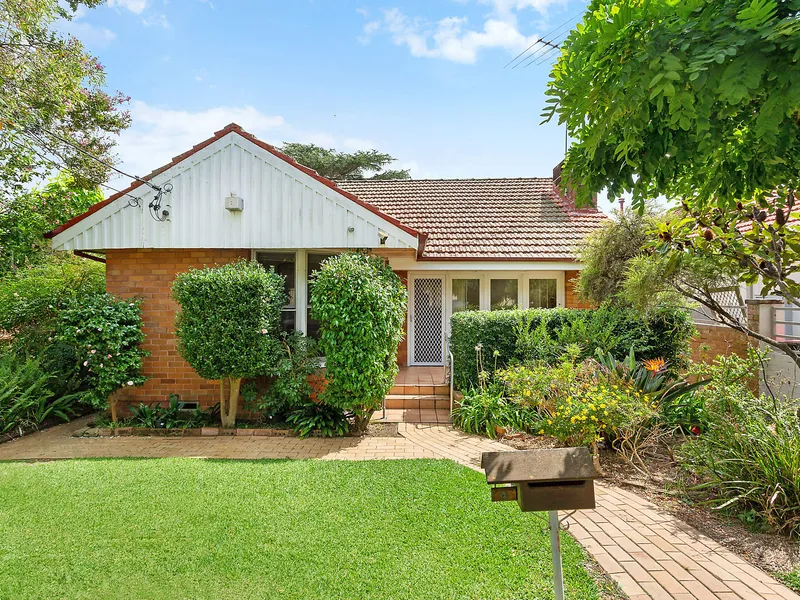 Charming full brick cottage in central setting