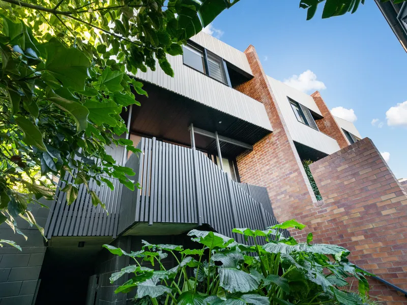 Tri-Level Green Oasis with an Industrial Edge