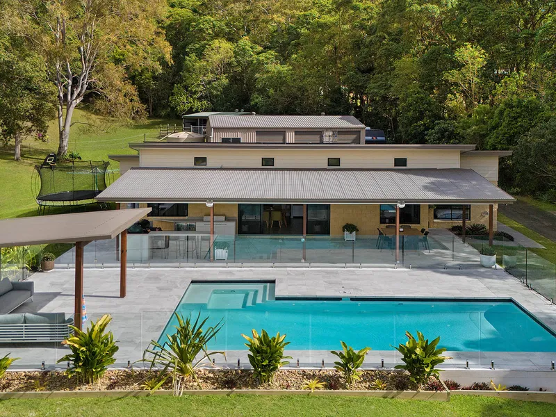 SPECTACULAR HORSE FRIENDLY ACREAGE WITH SHEDS, POOL AND STABLES