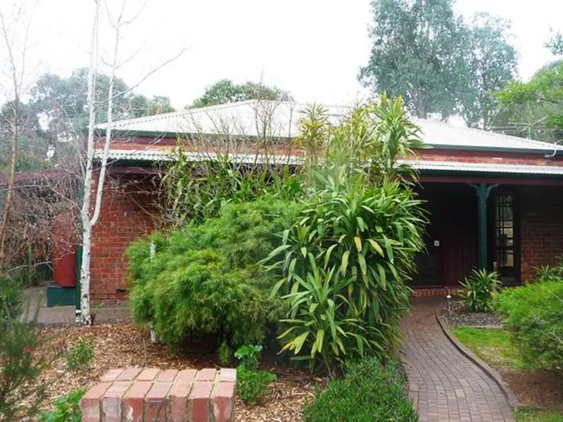 Charming brick home in generous garden setting! Pets considered