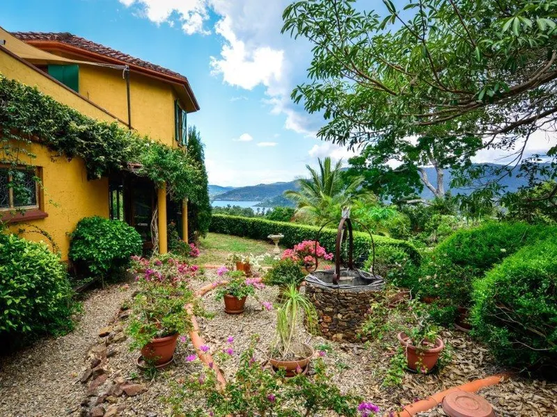 UNIQUE STYLISH  FRENCH BUILT HOUSE ON 3 ACRES , EXCEPTIONAL WATER VIEWS AND CATERING FOR SMALL FUNCTIONS AND WEDDINGS.