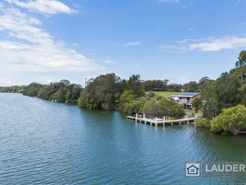 Riverfront home with income