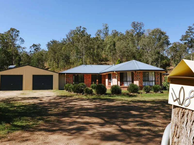 Private large modern 4 bedroom brick home on fully fenced 23 acres.