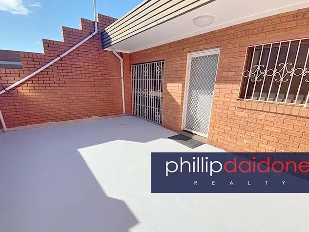 Opposite Woolworths.