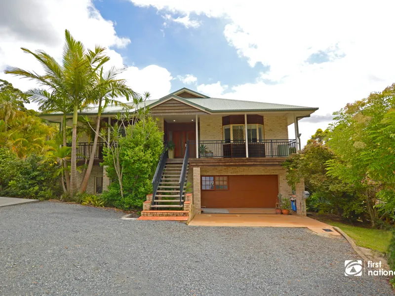 Substantial dual living in a private park like setting.