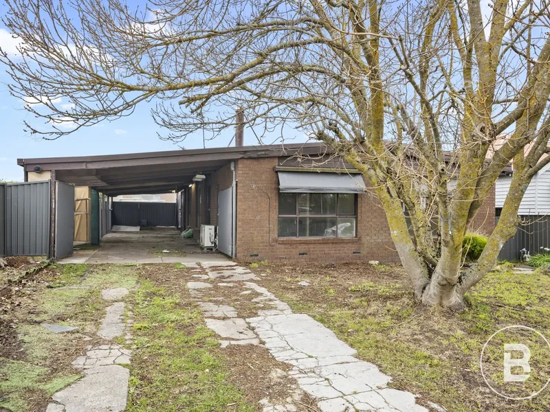 THREE-BEDROOM BRICK HOME WITH HUGE POTENTIAL