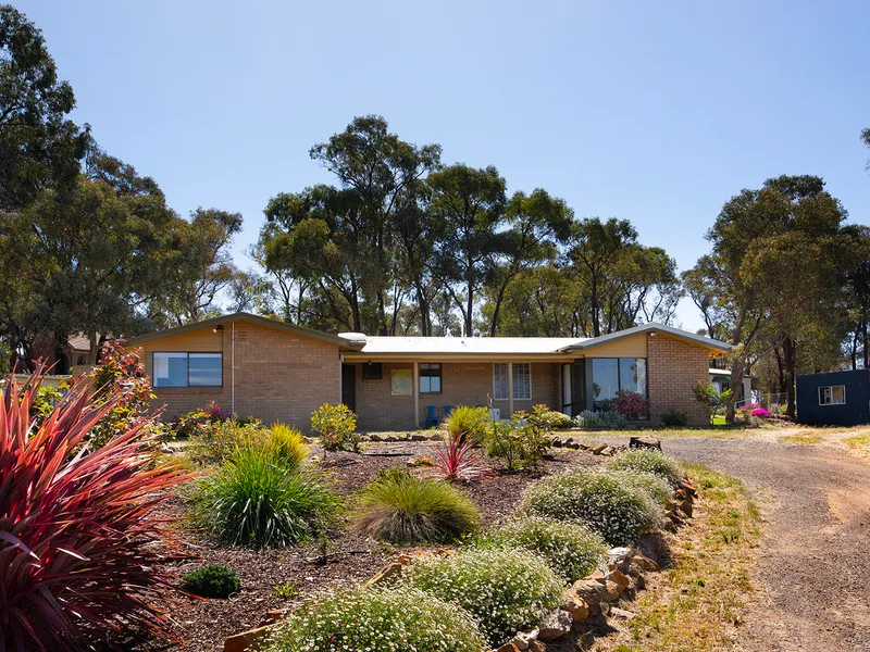 BEAUTIFULLY PRESENTED 4 BEDROOM HOME ON AN ACRE BLOCK IN THE HEART OF SPRING GULLY