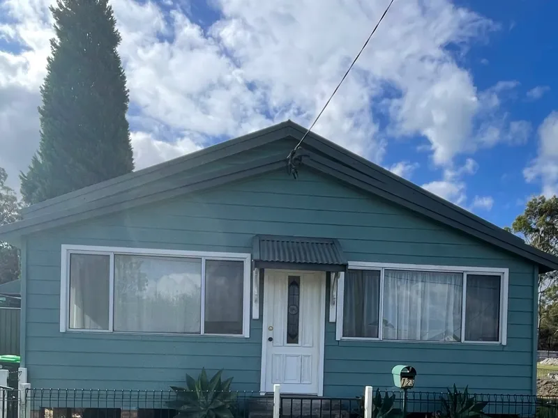Charming Three Bedroom Home with Modern Features and Spacious Yard