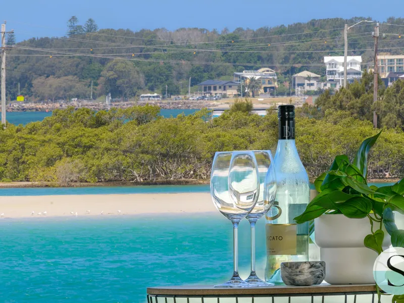 Take the lift to next level living, near new & easy care, 1 house off the water, 2 street access, drive thru 4 car garage - live up & rent down!