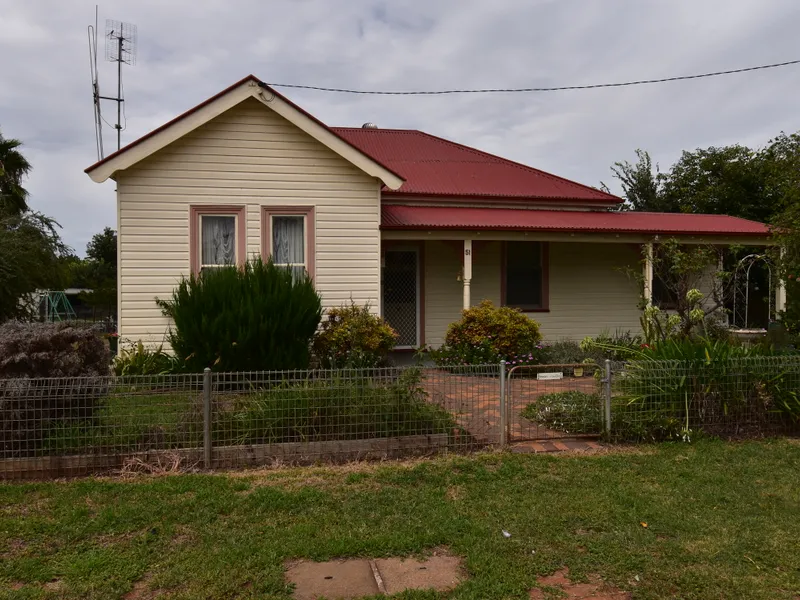 Character home with potential and huge block.