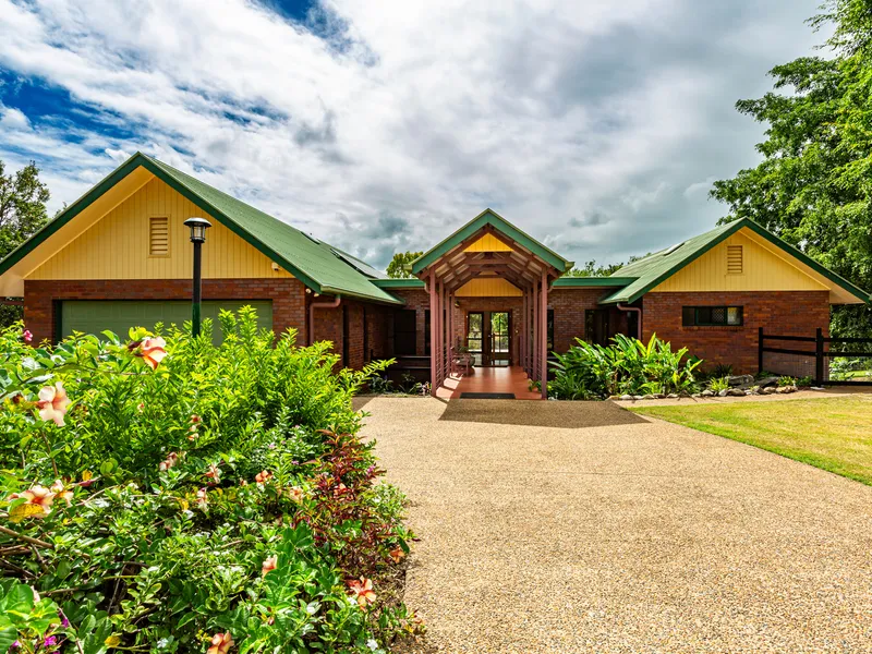 Grand brick home with over an acre of land backing on to the Botanical Gardens