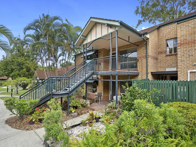 Sit back and relax on the private balcony of this lovely two-bedroom home