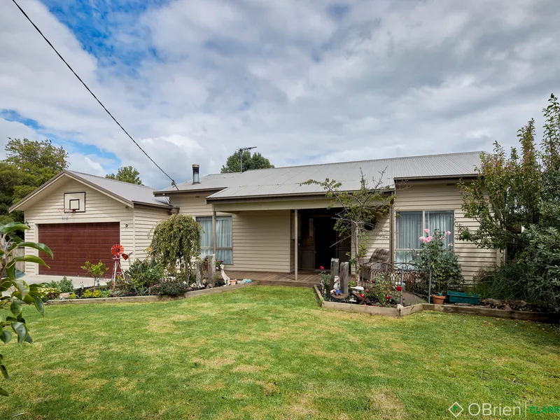 A Quarter Acre Warm Family Home with Great Shedding