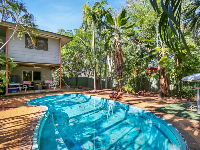 Tropical Paradise in sought after location!